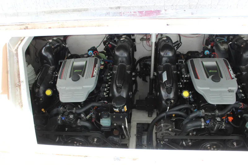 Slide: The Image of Twin engines of a 2013 Rinker 31 boat in the engine compartment. - 41
