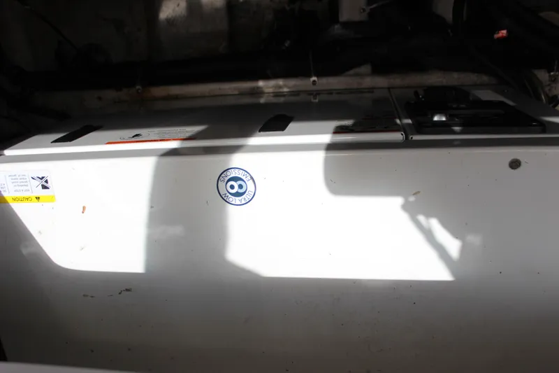 Slide: The Image of Engine compartment of a 2013 Rinker 31 boat. - 42