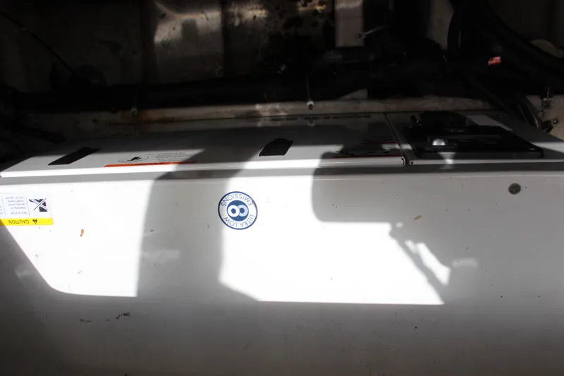 Slide: The Image of Engine compartment of a 2013 Rinker 31 boat. - 43
