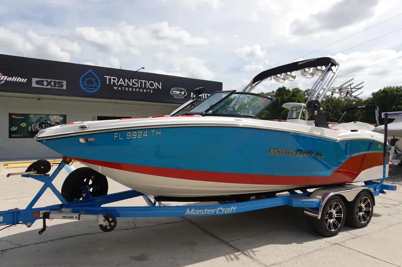 Slide: The Image of 2021 MasterCraft NXT22 boat on a trailer at Transition WaterSports. - 1