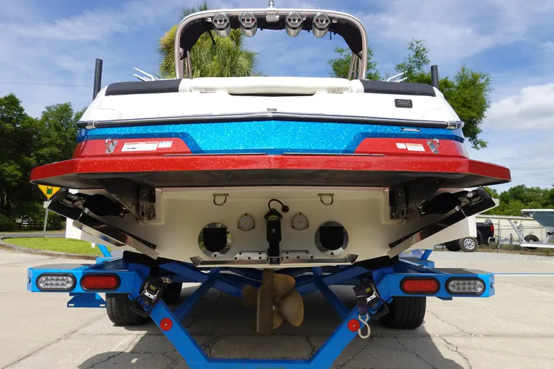 Slide: The Image of 2021 MasterCraft NXT22 boat rear view on trailer. - 12