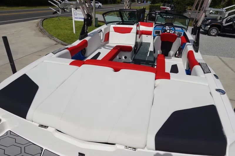 Slide: The Image of 2021 MasterCraft NXT22 boat interior with red and white seating. - 14
