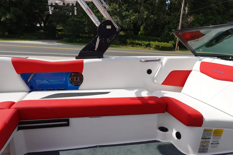 Slide: The Image of 2021 MasterCraft NXT22 boat interior with red and white seating. - 17