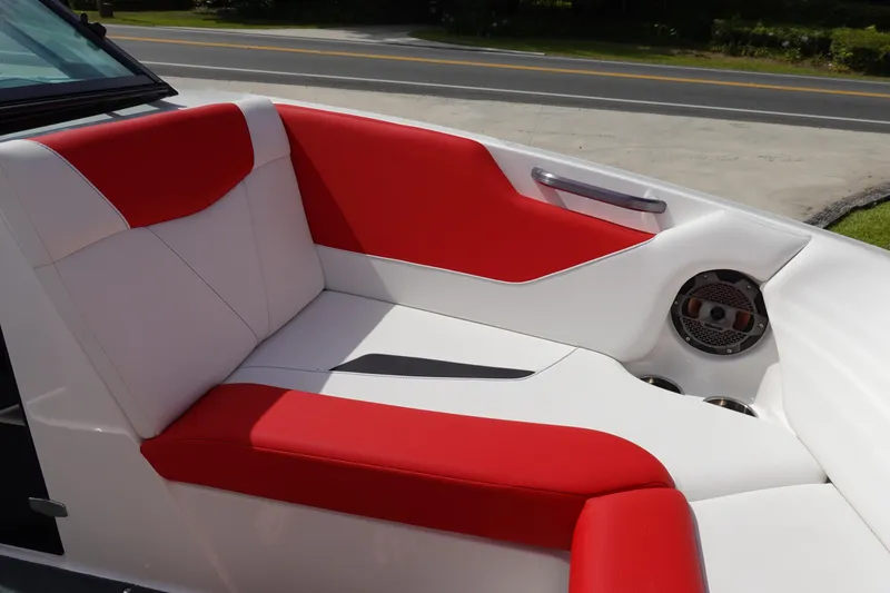 Slide: The Image of 2021 MasterCraft NXT22 boat interior with red and white seating. - 25