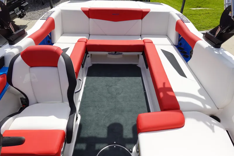 Slide: The Image of 2021 MasterCraft NXT22 boat interior with red and white seating. - 27