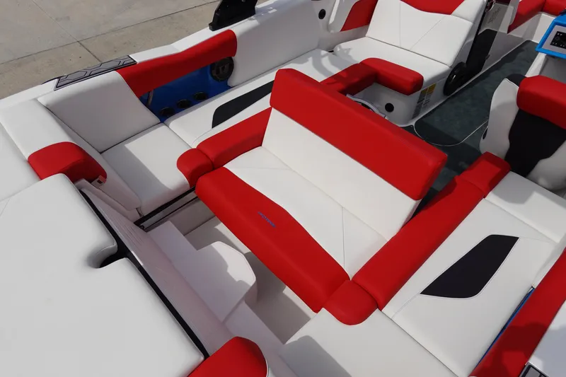 Slide: The Image of 2021 MasterCraft NXT22 boat interior with red and white seating. - 28