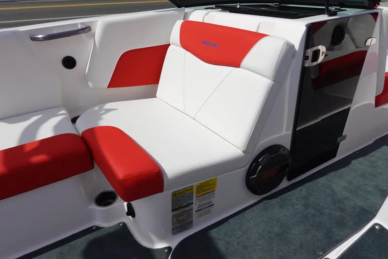 Slide: The Image of 2021 MasterCraft NXT22 boat interior with red and white seating. - 29