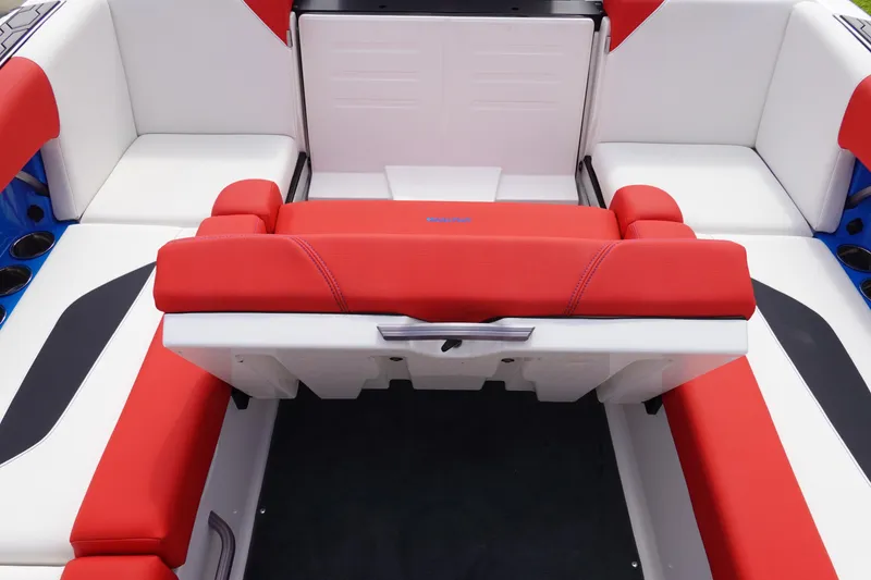 Slide: The Image of 2021 MasterCraft NXT22 boat interior with red and white seating. - 30