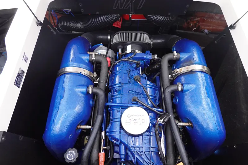 Slide: The Image of 2021 MasterCraft NXT22 boat engine with blue components. - 36