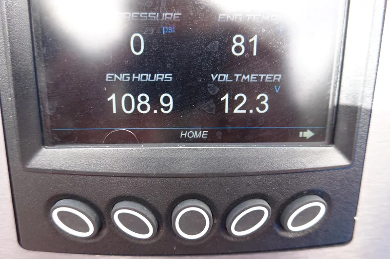 Slide: The Image of Close-up of 2021 MasterCraft NXT22 boat dashboard display showing engine hours and voltmeter. - 37