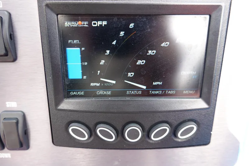 Slide: The Image of 2021 MasterCraft NXT22 dashboard display showing fuel, RPM, and speed gauges. - 38