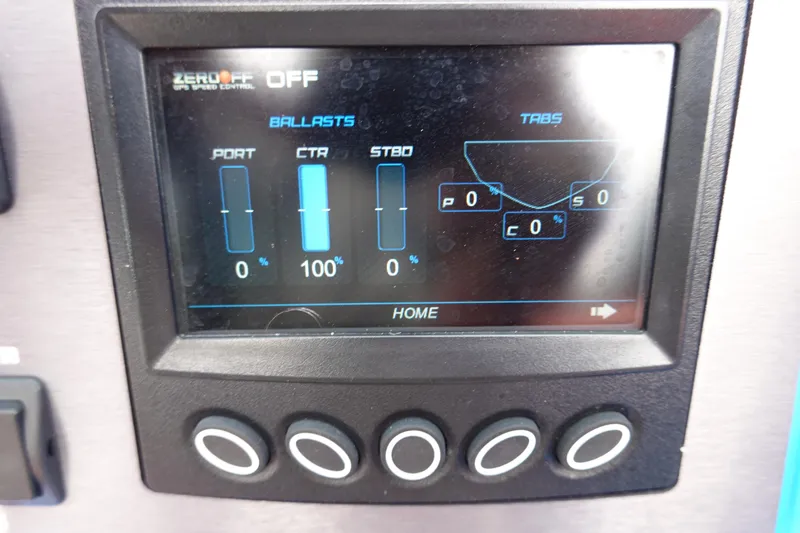 Slide: The Image of 2021 MasterCraft NXT22 boat control panel display showing ballast and tab settings. - 39