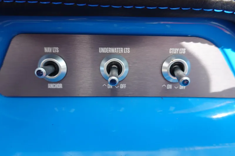 Slide: The Image of Switch panel of a 2021 MasterCraft NXT22 boat with navigation, underwater, and courtesy lights. - 42