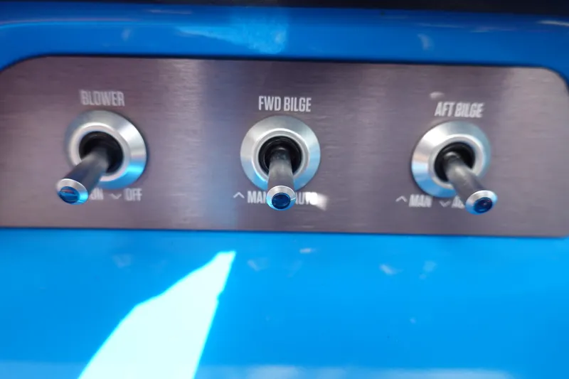 Slide: The Image of 2021 MasterCraft NXT22 boat control panel with blower and bilge switches. - 43