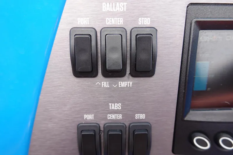 Slide: The Image of 2021 MasterCraft NXT22 ballast and tabs control panel. - 45