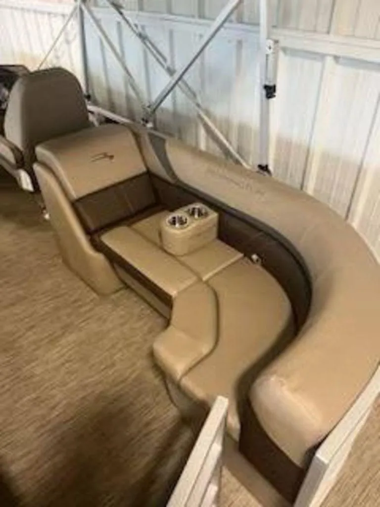 Slide: The Image of 2022 Bennington 22 SXSR SPS boat interior seating with cup holders. - 6