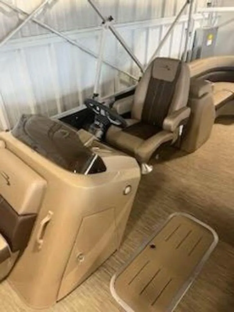 Slide: The Image of 2022 Bennington 22 SXSR SPS boat interior with captain's chair and control console. - 7