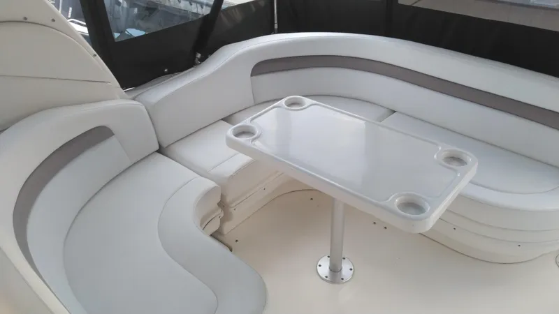 Slide: The Image of 2004 Sea Ray 340 Sundancer interior seating area with table. - 13