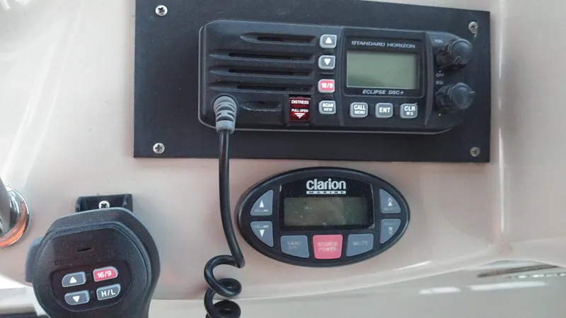 Slide: The Image of Control panel of a 2004 Sea Ray 340 Sundancer boat with radio and Clarion audio system. - 32