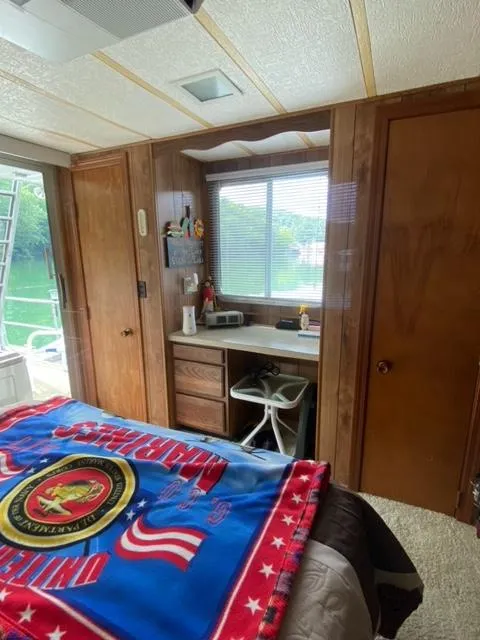 Slide: The Image of 1984 Sumerset Houseboat 14 x 60 interior bedroom with desk and window. - 11