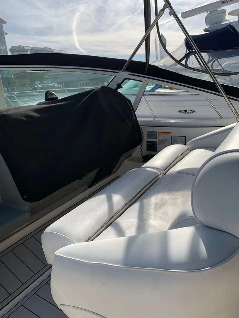Slide: The Image of Interior of a 2006 Cruisers 320 Express boat with white seating. - 26