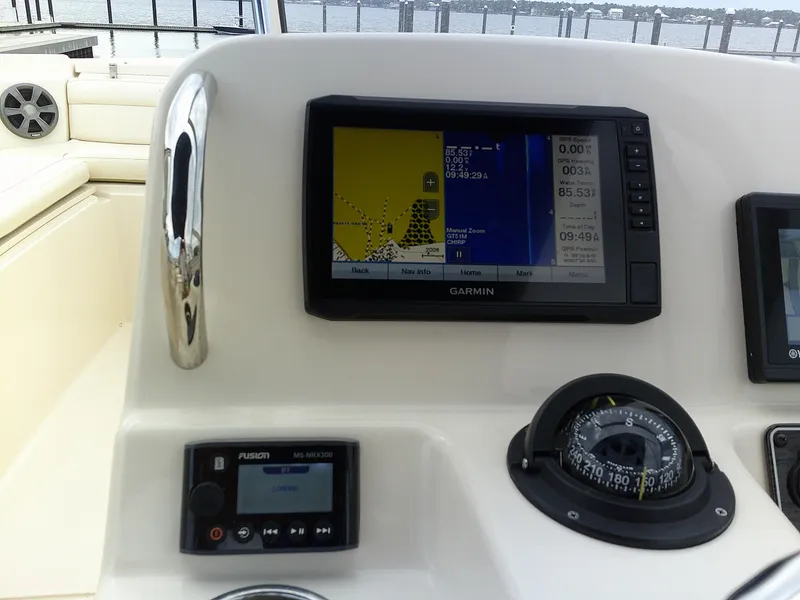 Slide: The Image of 2019 Grady-White Freedom 215 boat dashboard with Garmin GPS and Fusion MS-NRX300. - 12