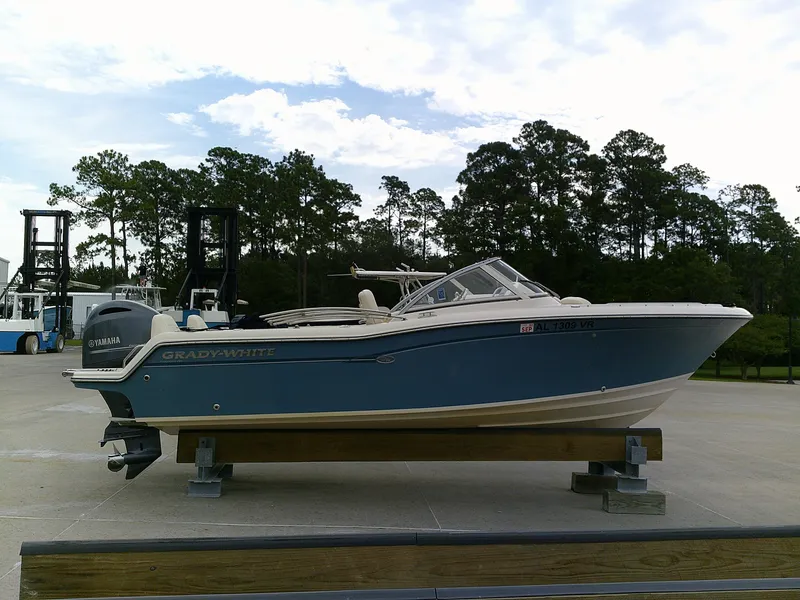 Slide: The Image of 2019 Grady-White Freedom 215 boat on a stand, side view, with Yamaha engine. - 3
