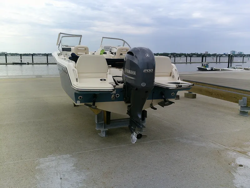 Slide: The Image of 2019 Grady-White Freedom 215 boat with Yamaha 200 outboard motor on dock. - 5