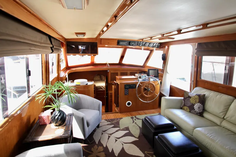 Slide: The Image of Luxurious 1984 Symbol 51 yacht interior with plush seating and elegant decor. - 15