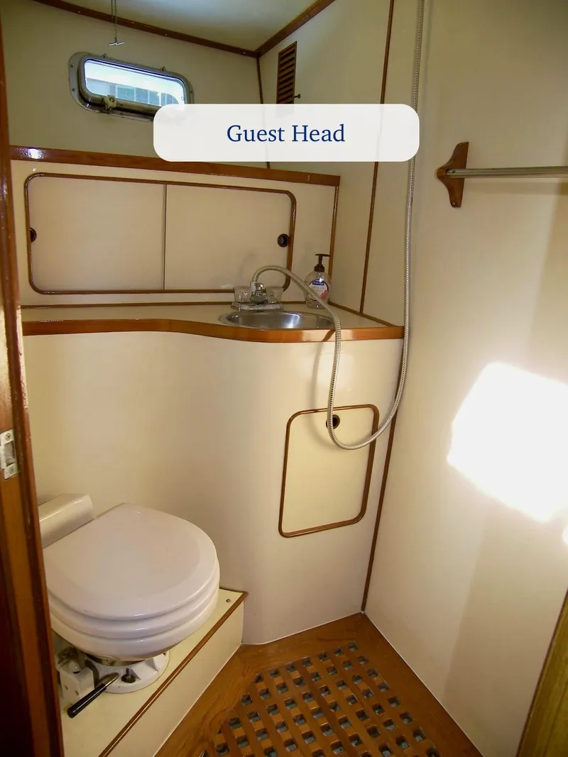 Slide: The Image of 1984 Symbol 51 yacht guest head with sink, toilet, and shower. - 26