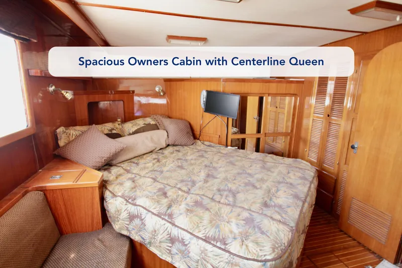 Slide: The Image of Spacious owner's cabin with centerline queen bed in 1984 Symbol 51 yacht. - 30