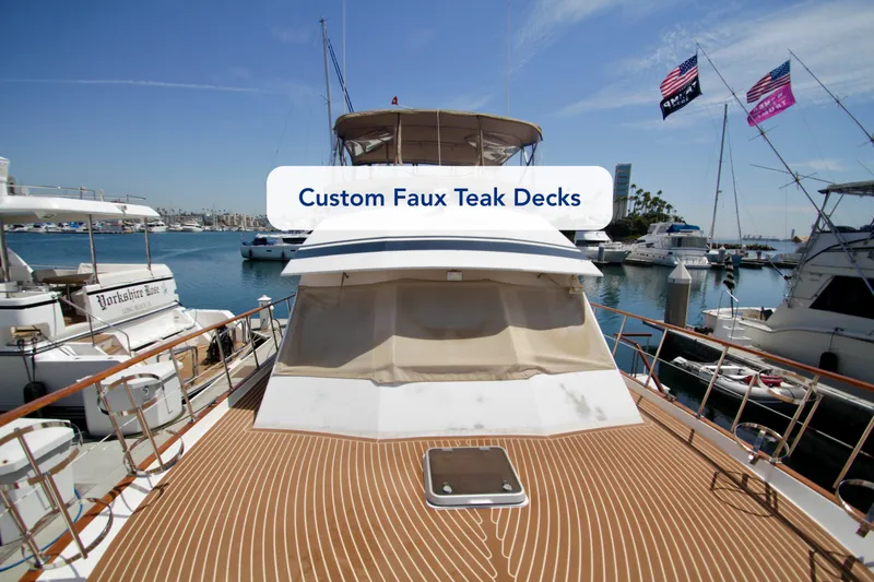 Slide: The Image of Luxury yacht with custom faux teak decks, docked in a marina, Symbol 51, 1984 model. - 6