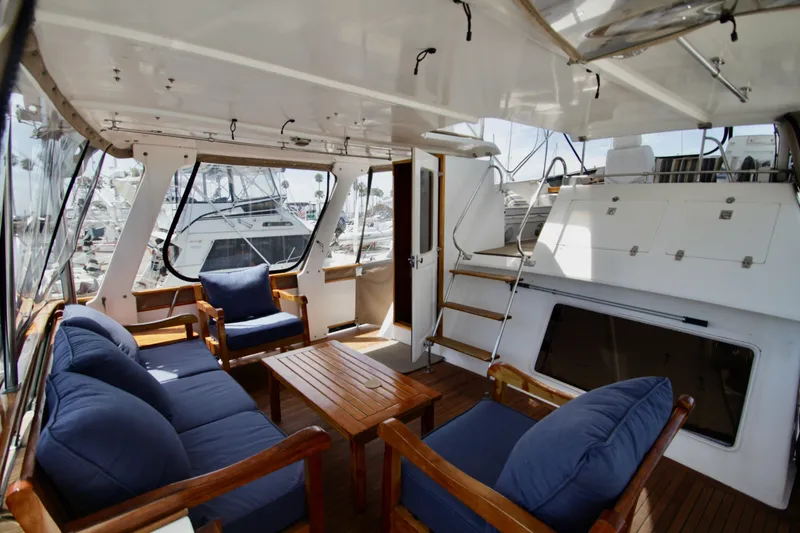 Slide: The Image of Luxurious 1984 Symbol 51 yacht interior with comfortable seating and wooden accents. - 8