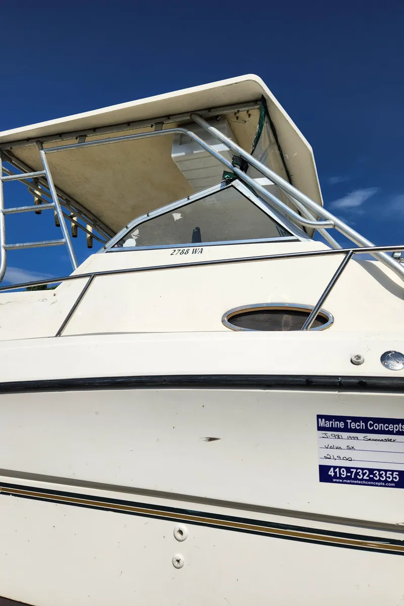 Slide: The Image of 1999 Renken 2788 boat with Marine Tech Concepts contact information. - 2