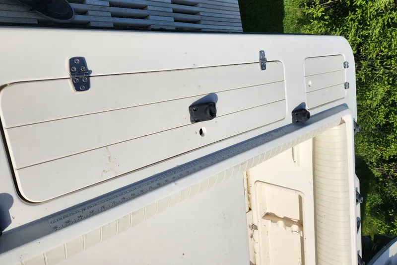 Slide: The Image of 1999 Renken 2788 boat deck with storage compartments. - 8