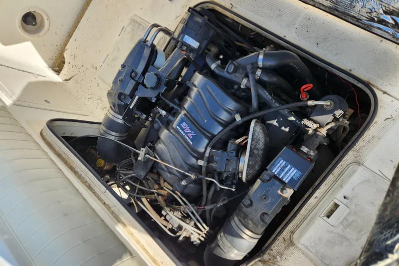 Slide: The Image of 1999 Renken 2788 boat engine compartment with visible motor and components. - 9