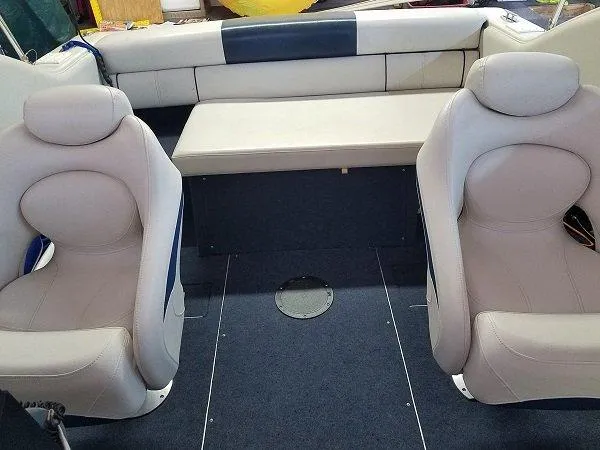 Slide: The Image of Interior of a 1992 Crownline 210 CCR boat with two seats and a bench. - 10
