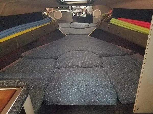 Slide: The Image of Interior cabin of a 1992 Crownline 210 CCR boat with cushioned seating. - 9