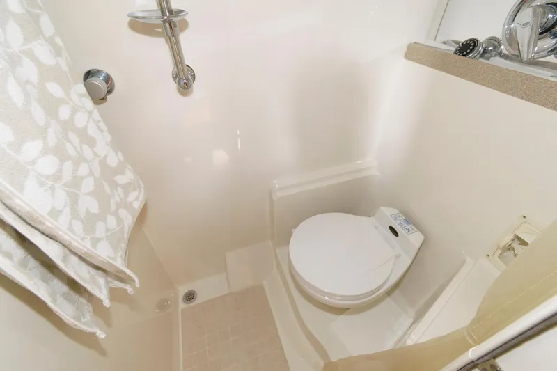 Slide: The Image of Compact bathroom in 2002 Regal Commodore 3860 yacht with shower and toilet. - 19