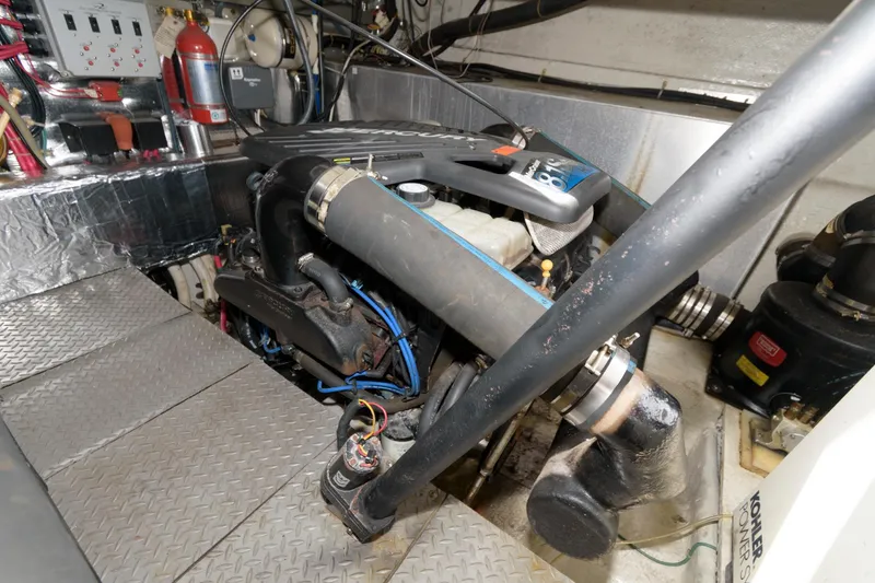 Slide: The Image of Engine room of a 2002 Regal Commodore 3860 yacht with visible components. - 23