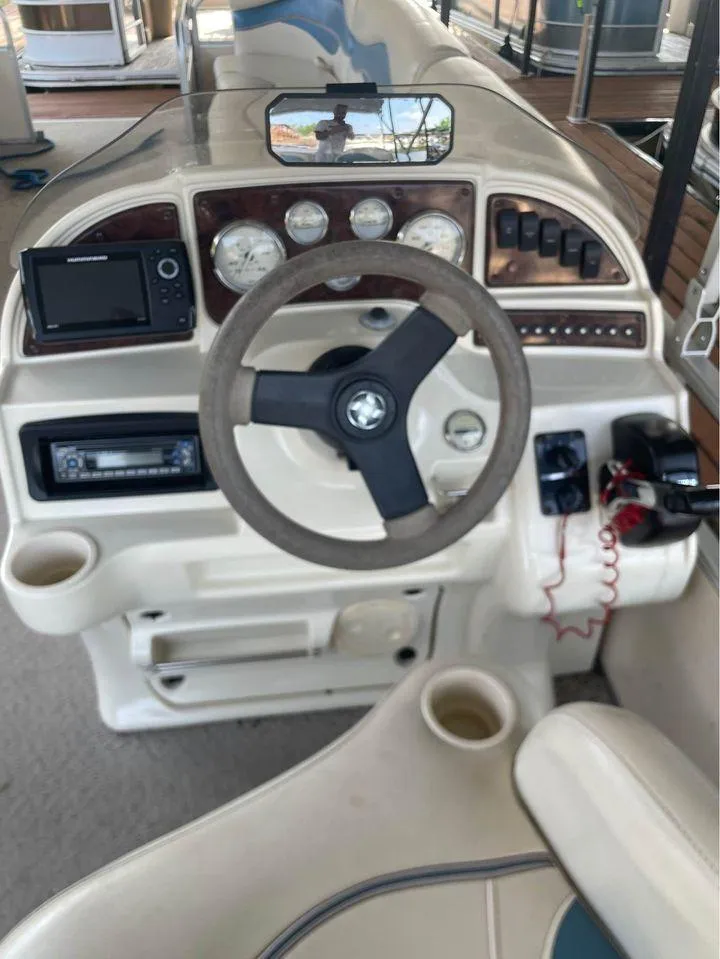 Slide: The Image of 2008 Sweetwater SW 2386 DFS-3 Gate boat dashboard with steering wheel and control panel. - 3
