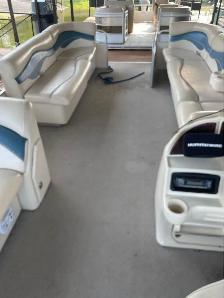 Slide: The Image of 2008 Sweetwater SW 2386 DFS-3 Gate pontoon boat interior with seating and control console. - 4