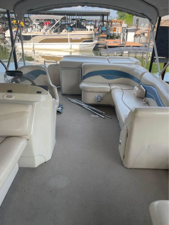 Slide: The Image of 2008 Sweetwater SW 2386 DFS-3 Gate pontoon boat interior with seating and helm. - 5