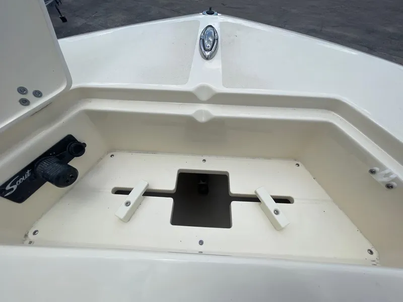 Slide: The Image of 2024 Scout 195 Sportfish boat bow storage compartment. - 11