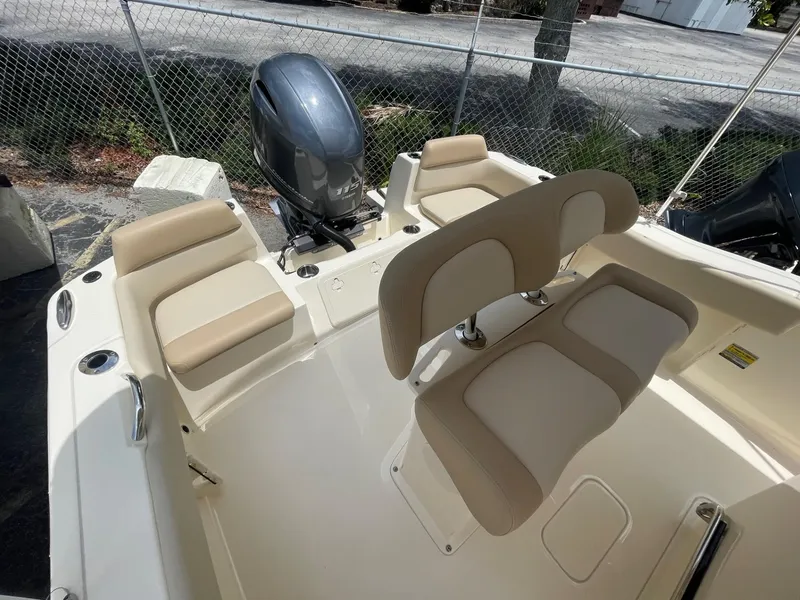 Slide: The Image of 2024 Scout 195 Sportfish boat interior with seating and outboard motor. - 4