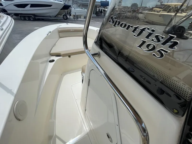 Slide: The Image of 2024 Scout 195 Sportfish boat interior with seating and console. - 8