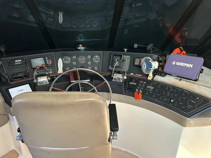 Slide: The Image of 1994 Bayliner 4788 yacht helm with Garmin navigation system and control panel. - 18