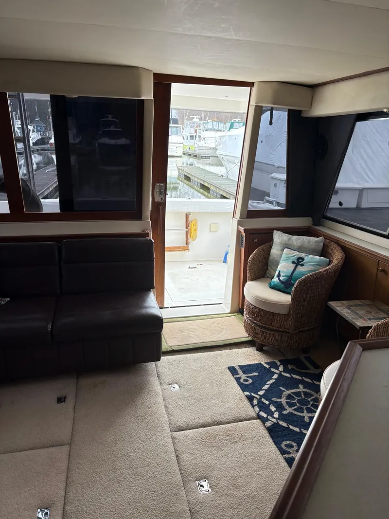Slide: The Image of Interior of 1994 Bayliner 4788 yacht with cozy seating and nautical decor. - 21