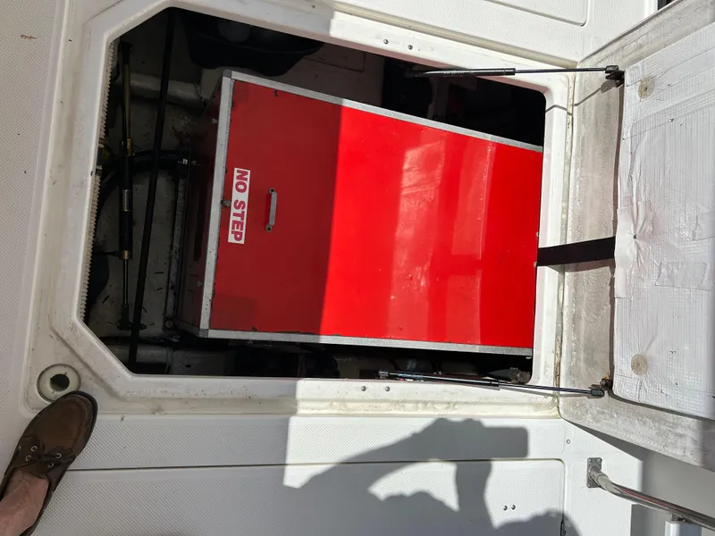 Slide: The Image of Engine compartment of a 1994 Bayliner 4788 with a red No Step cover. - 7