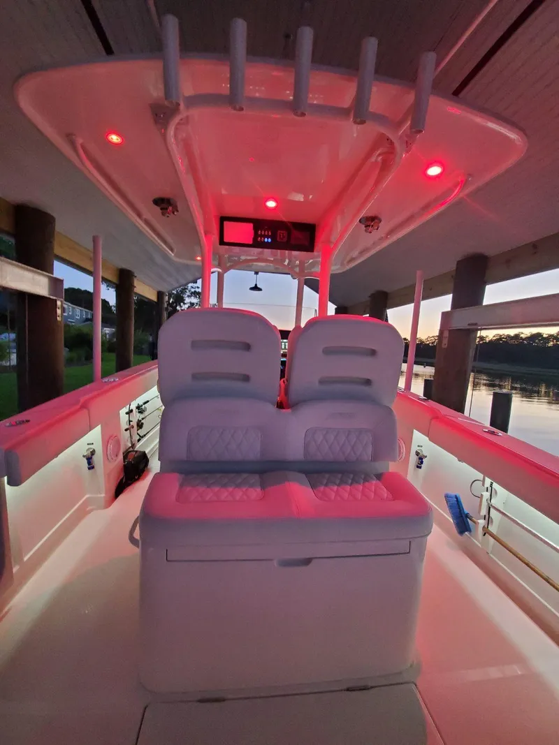 Slide: The Image of 2019 Jupiter 30 HFS boat interior with red LED lighting at sunset. - 13